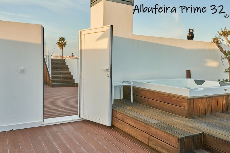 Door from the private roof terrace to the steps up to the communal pool